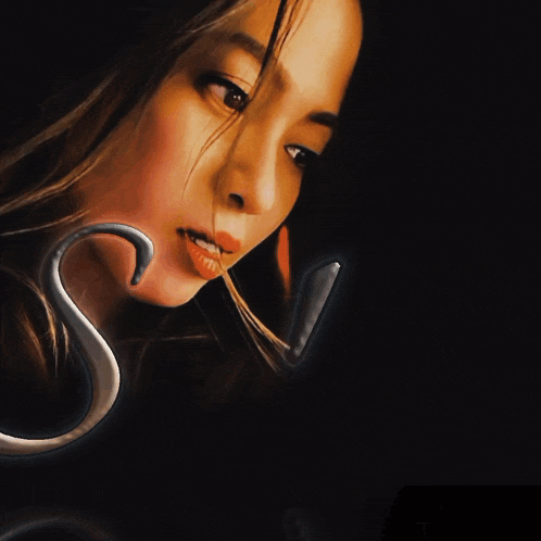 a close up of a woman 's face with the letter a in the foreground