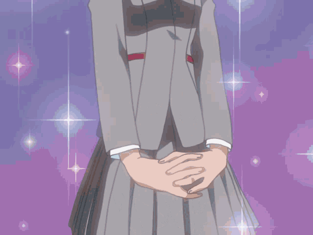 a girl in a suit with a red bow is smiling