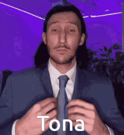 a man in a suit and tie is adjusting his tie with the word tona written on the bottom .