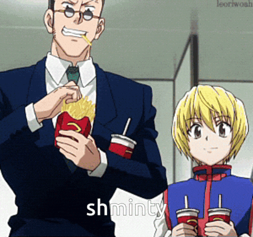a man in a suit is eating french fries next to a girl who is holding a drink