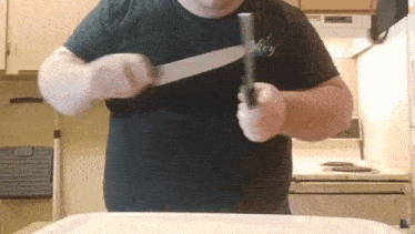 a man in a black shirt with the word key on it
