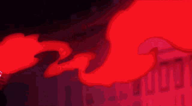 a close up of a red flame coming out of a cartoon character 's mouth .