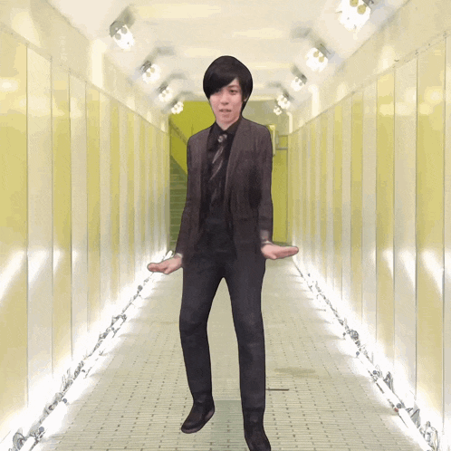 a man in a suit is standing in a hallway