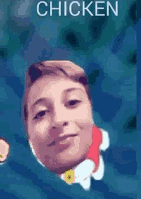 a young boy with a chicken wing on his head .