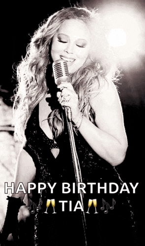 a black and white photo of a woman singing into a microphone with the caption happy birthday tia .