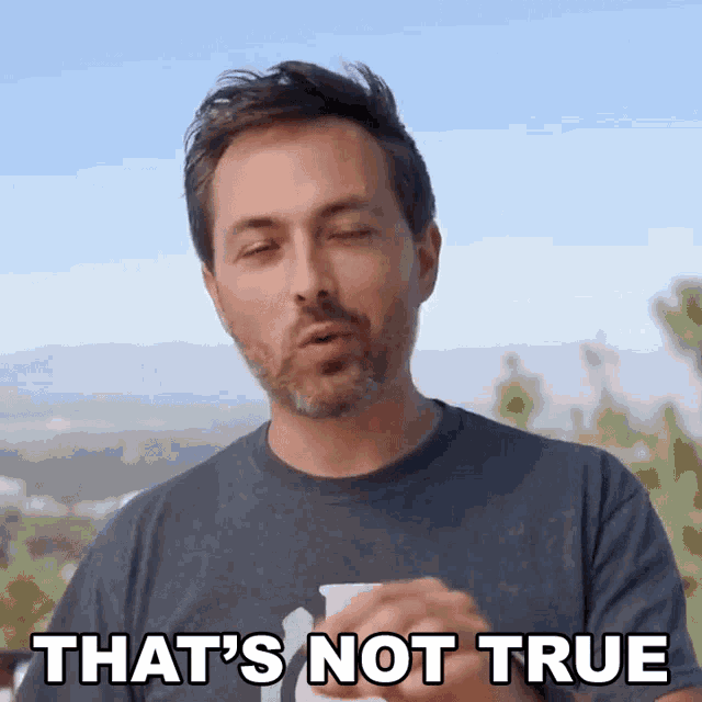 a man says that 's not true while holding a cup