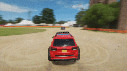 a red jeep with a new york license plate is driving down a dirt road
