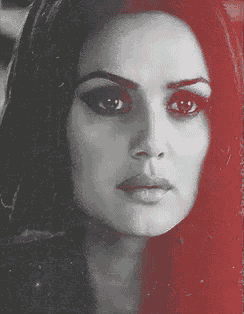 a woman 's face is shown in a black and white photo