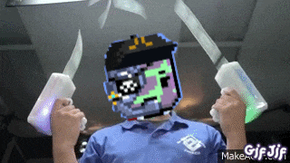a man in a blue shirt is holding two knives in front of his face
