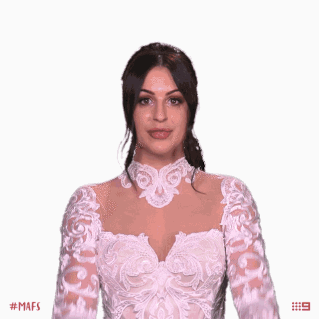 a woman in a white lace dress with the hashtag # mafs on the bottom