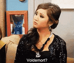 a woman is wearing a black shirt that says voldemort on it