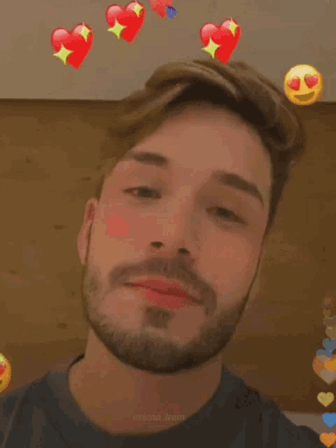 a man with a beard and hearts on his face