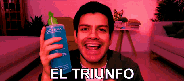a man is holding a bottle of oderma in his right hand