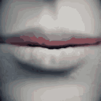a close up of a woman 's lips with red lipstick on them .