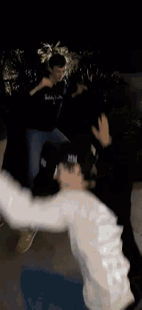 a person wearing a white sweatshirt that says yankees