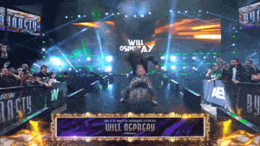 a wrestler named will osprey is on a stage