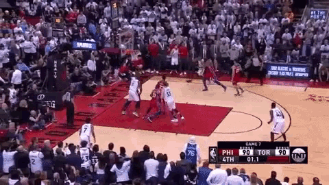 a basketball game is being played in front of a large crowd and the score is 90 to 90