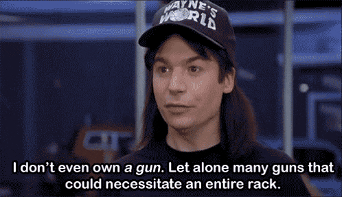 a man wearing a wayne 's world hat says i don 't even own a gun