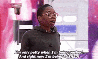 a man wearing glasses is talking about being pushed .