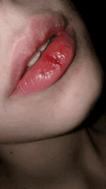 a close up of a person 's lips with blood