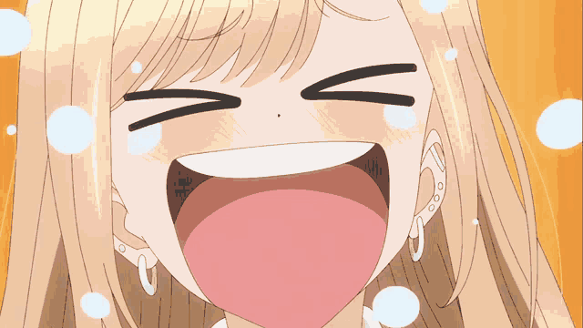 a close up of a girl 's face with her mouth open and tears coming out of her eyes