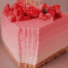 a close up of a strawberry cheesecake with strawberries on top .