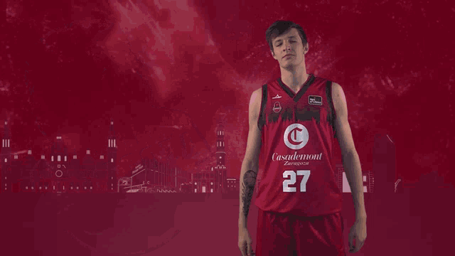 a basketball player wearing a red jersey with the number 27 on it