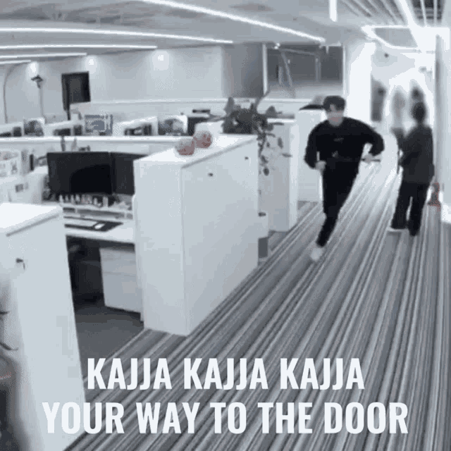 a man running in an office with the words kajja kajja kajja your way to the door below him