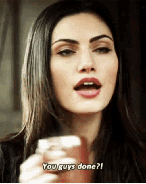 a woman is holding a cup of coffee and saying " you guys done "