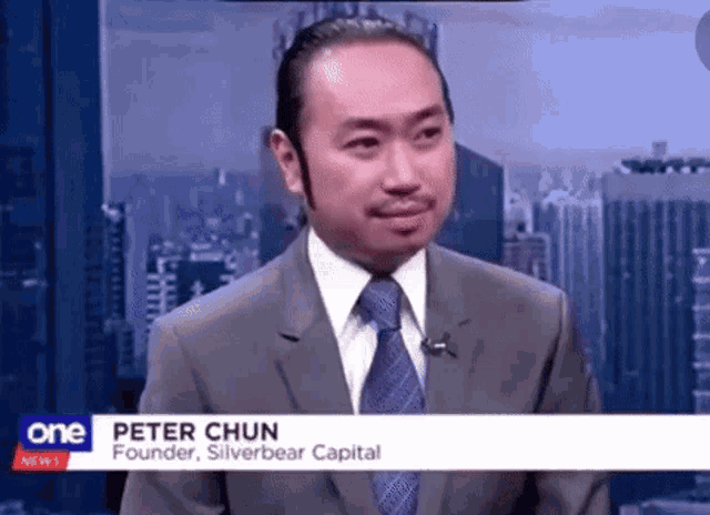 a man in a suit and tie is on a news channel called one news