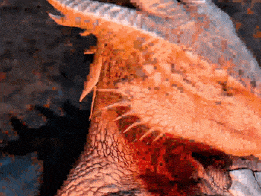 a pixel art of a dragon 's head with blood coming out of its mouth