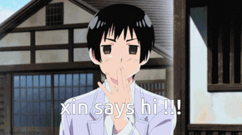 a man in a suit says xin says hi