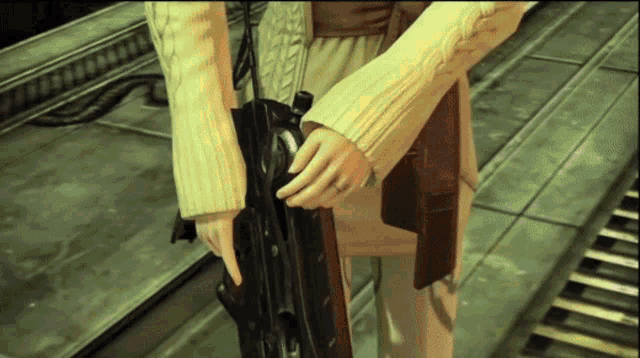 a woman in a sweater is holding a gun in her hand