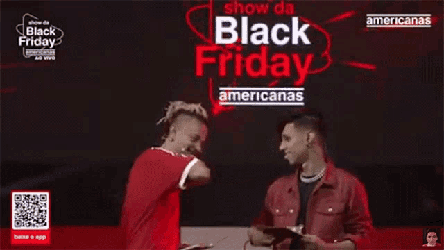 two men shaking hands in front of a sign that says black friday