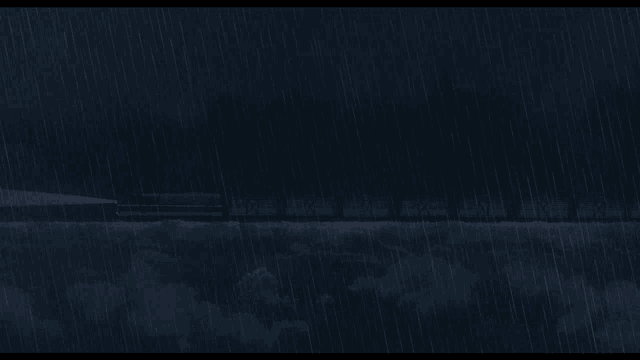 a lighthouse is lit up in the middle of a stormy night