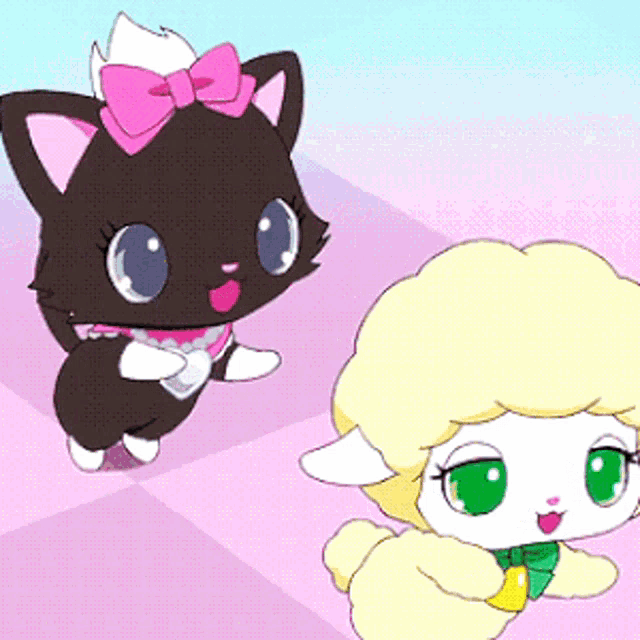 a black cat with a pink bow on its head is standing next to a white sheep