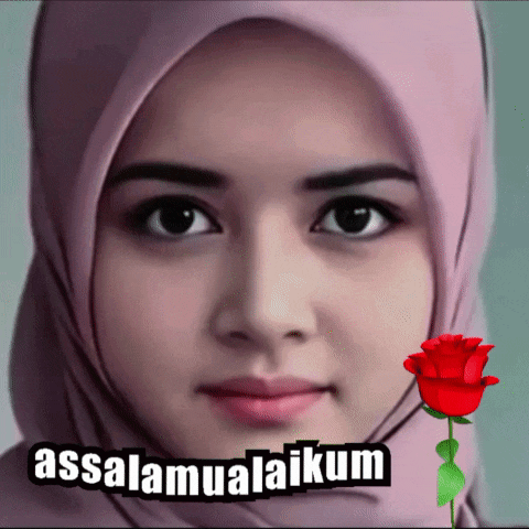 a woman wearing a pink hijab with the words assalamualaikum written on it