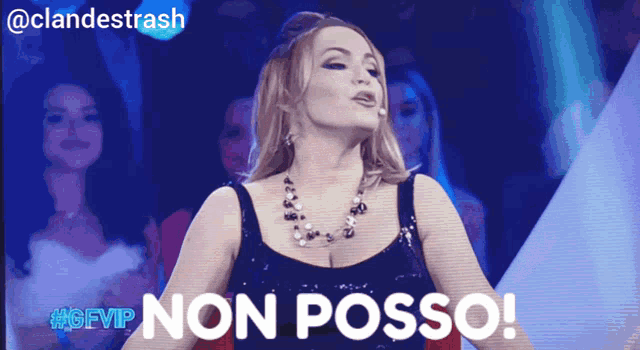 a woman stands in front of a crowd and says " non posso "