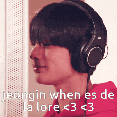 a man wearing headphones with the words jeongin when es de la lore < 3 < 3