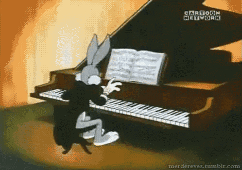 bugs bunny is playing a piano in a cartoon from cartoon network .