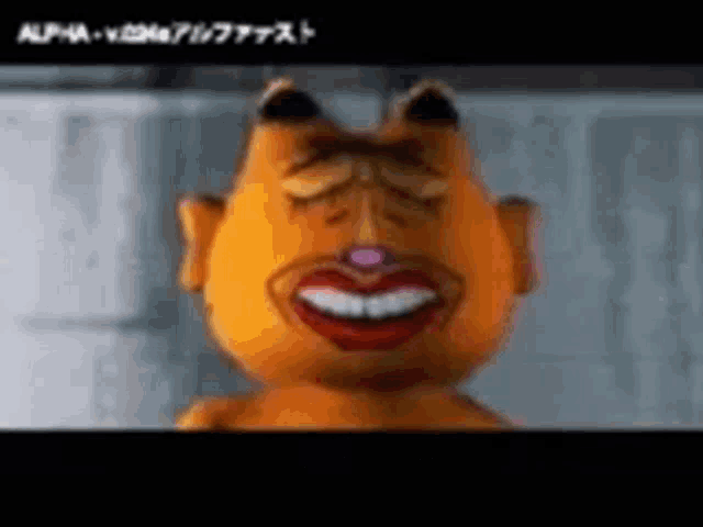 garfield is smiling with his eyes closed and his mouth open .