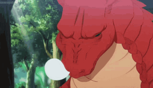 a close up of a red dragon with a white bubble around its mouth