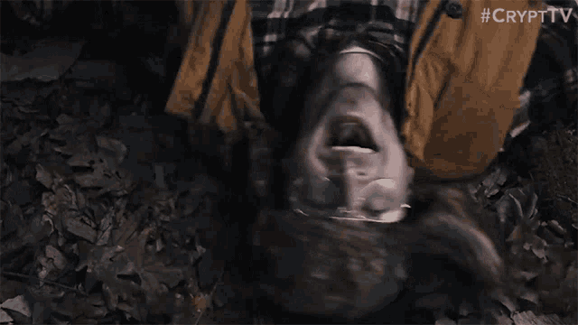 a man is laying on the ground with his mouth open and #cryptv written on the bottom of the image