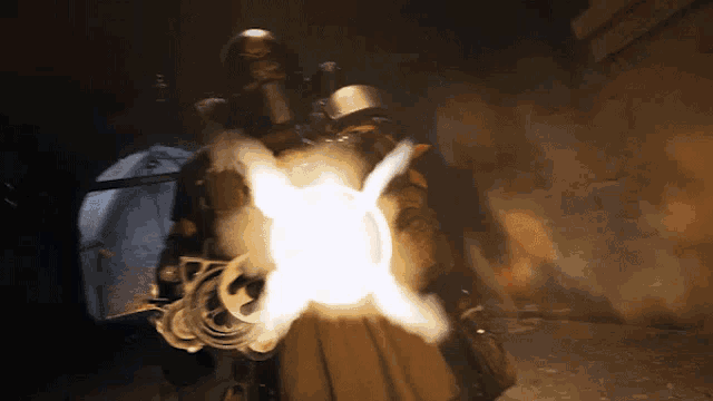 a person is holding a torch that is glowing in the dark