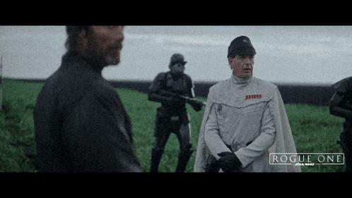 a poster for rogue one star wars shows soldiers in a field