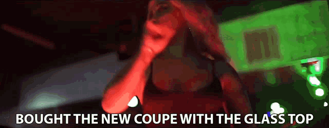a woman singing into a microphone with the words " bought the new coupe with the glass top " below her