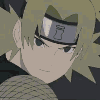 a close up of a cartoon character wearing a headband with a triangle on it .
