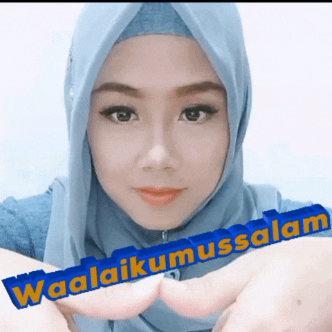 a woman wearing a blue hijab with the words waalaikumussalam written on it