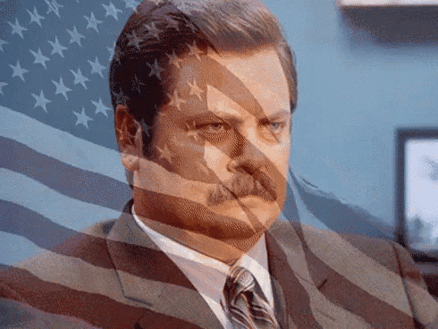 a man with an american flag behind him