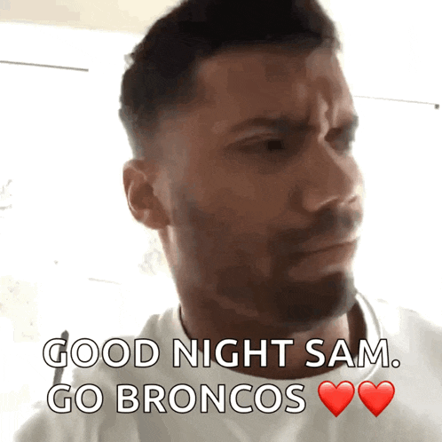 a man says good night sam go broncos with a red heart
